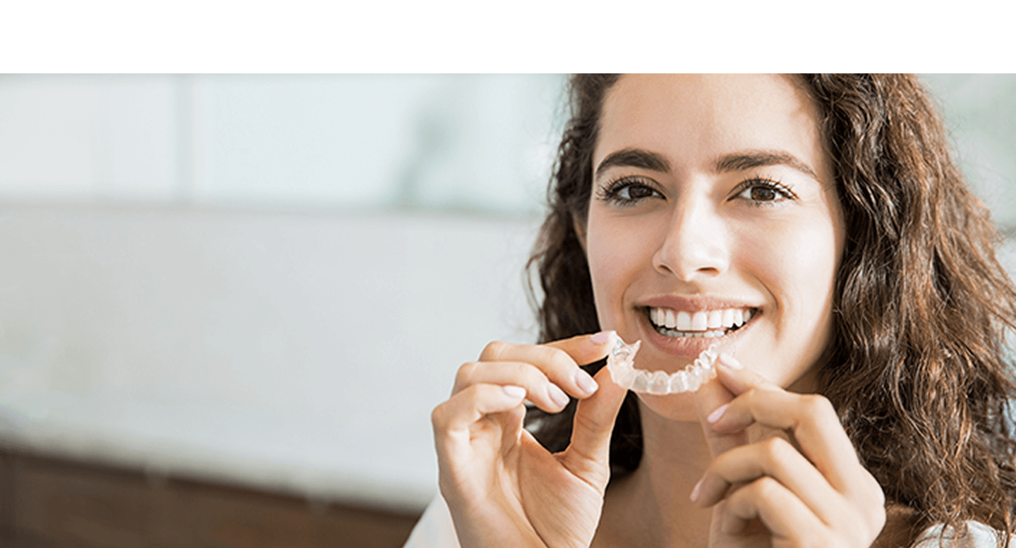 Woman with dental aligners